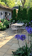 The pavers were re-used to make a space in the shade for a table